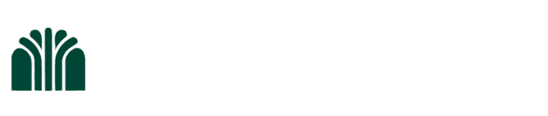 The green Heritage Bank logo with white type on a transparent background